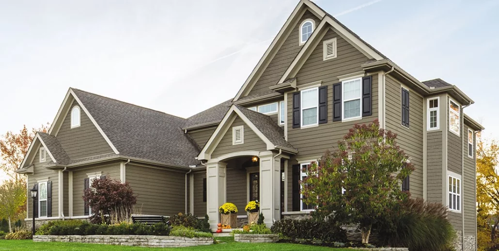 Fiber cement siding installed on two-story home in Des Moines Iowa by Black Ridge Contracting